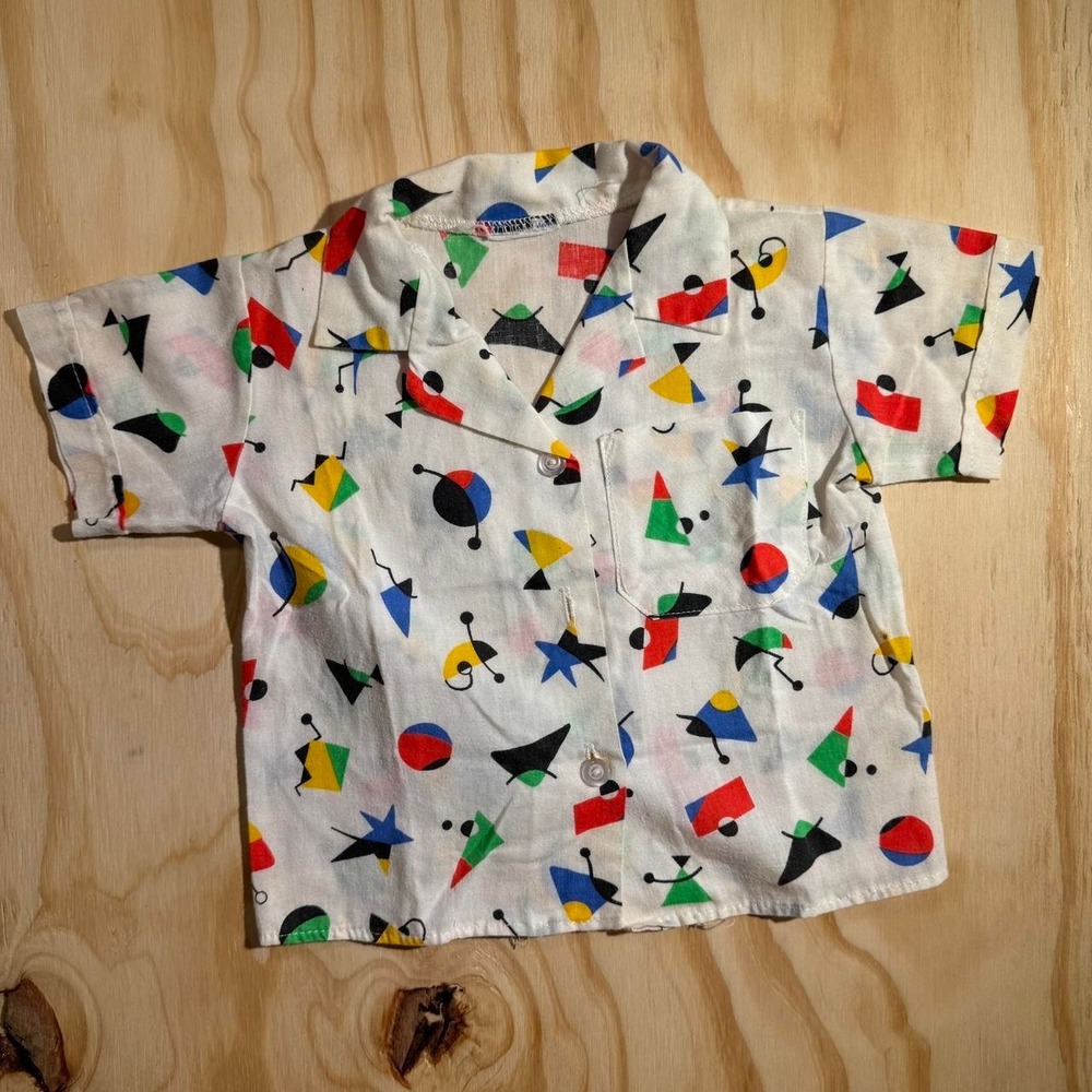 1970s white button up kids shirt with multicolored geometric shapes